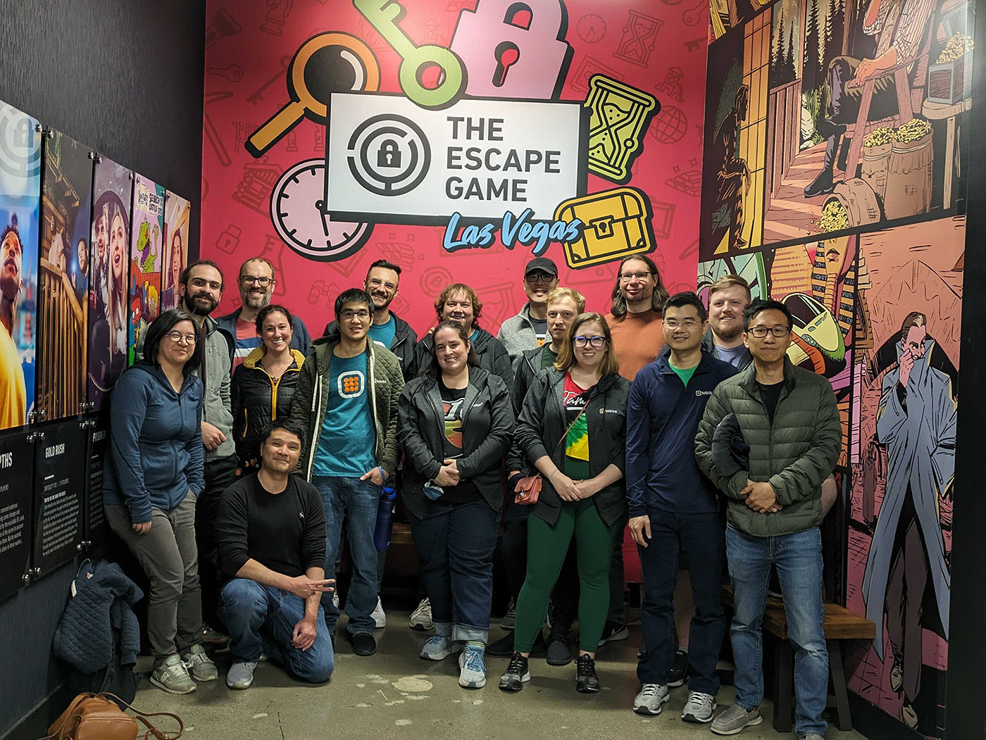 The Tobiko team smiling for the camera against a colorful backdrop at a team offsite at The Escape Game, Las Vegas